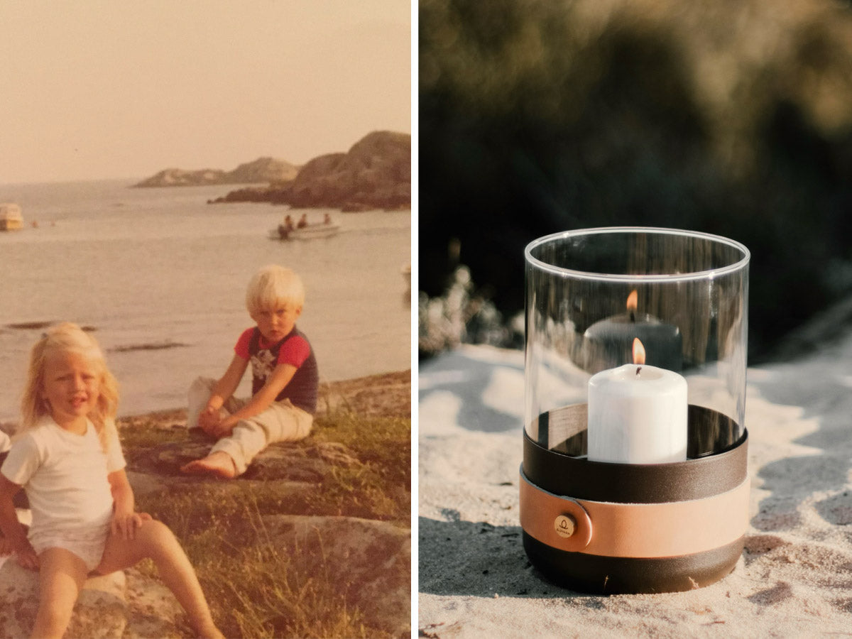 Children on the beach and an Eldvarm lantern in the sand