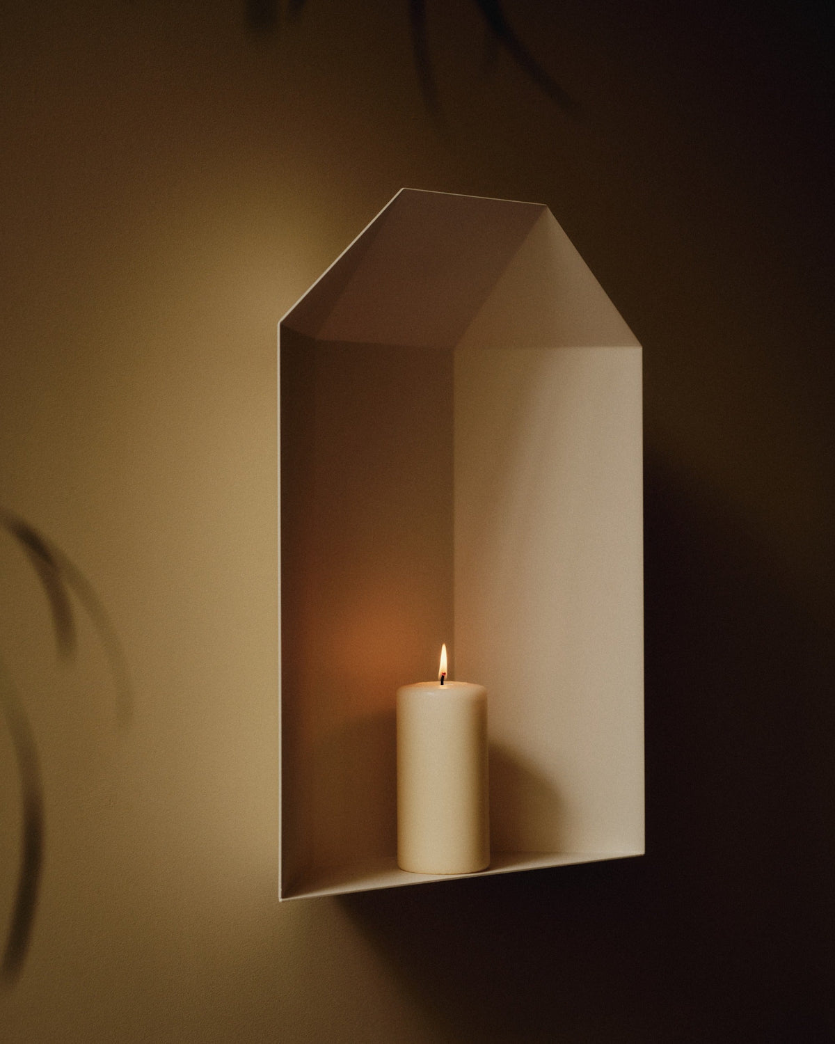 niche in white with candle