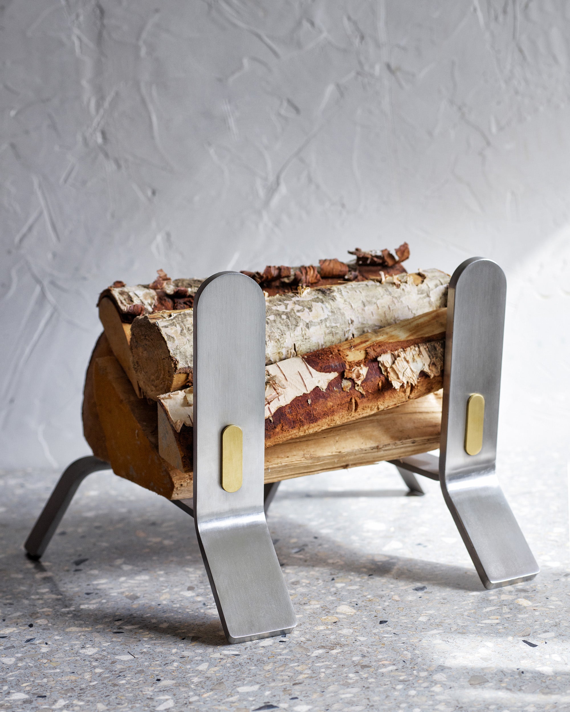 Eldvarm Cooper Fire Dogs Large - Lumière in a styled interior setting