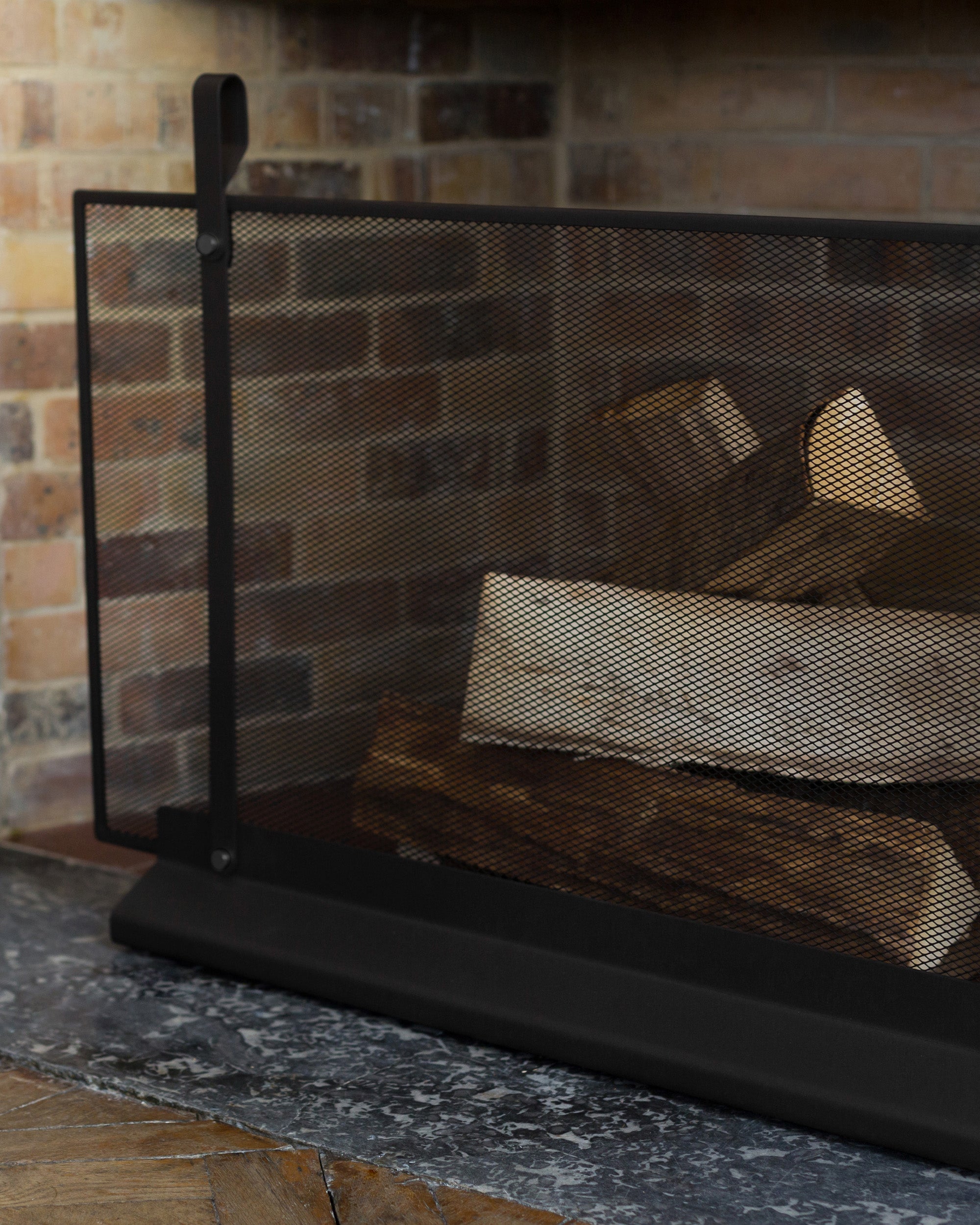 Eldvarm Emma Fireplace Screen Large - Noir A in a styled interior setting