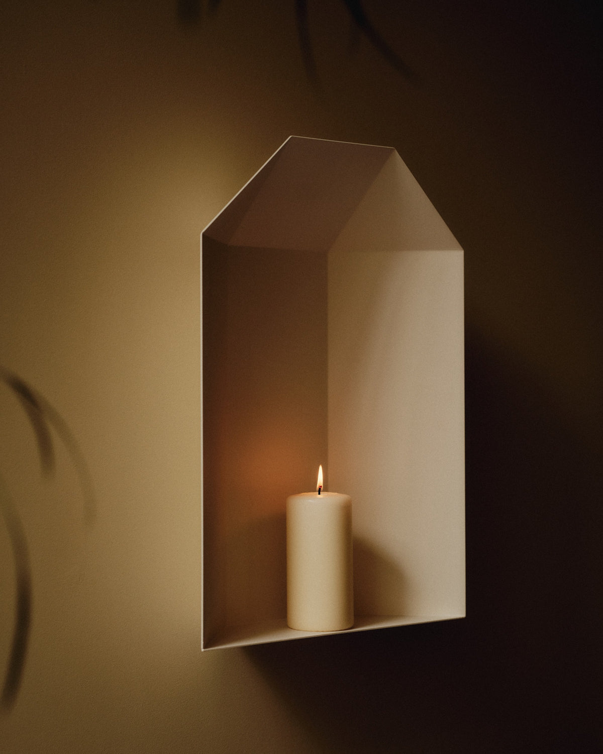 niche in white with candle