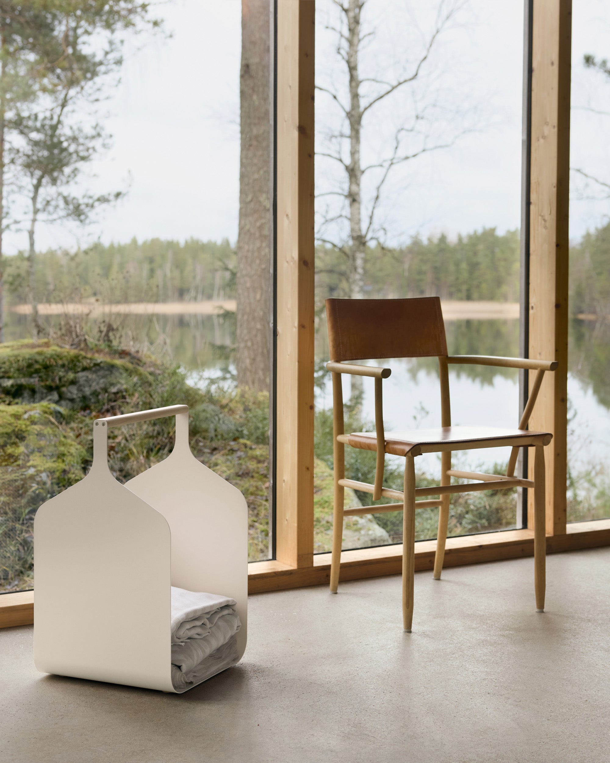 Eldvarm Fumi Log Holder - Blanc in a styled interior setting