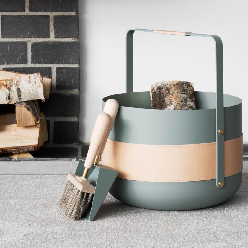 Emma Basket in Lichen (light green powder-coated steel, beige leather and solid brass details) with Emma Shovel & Brush in same colour.
