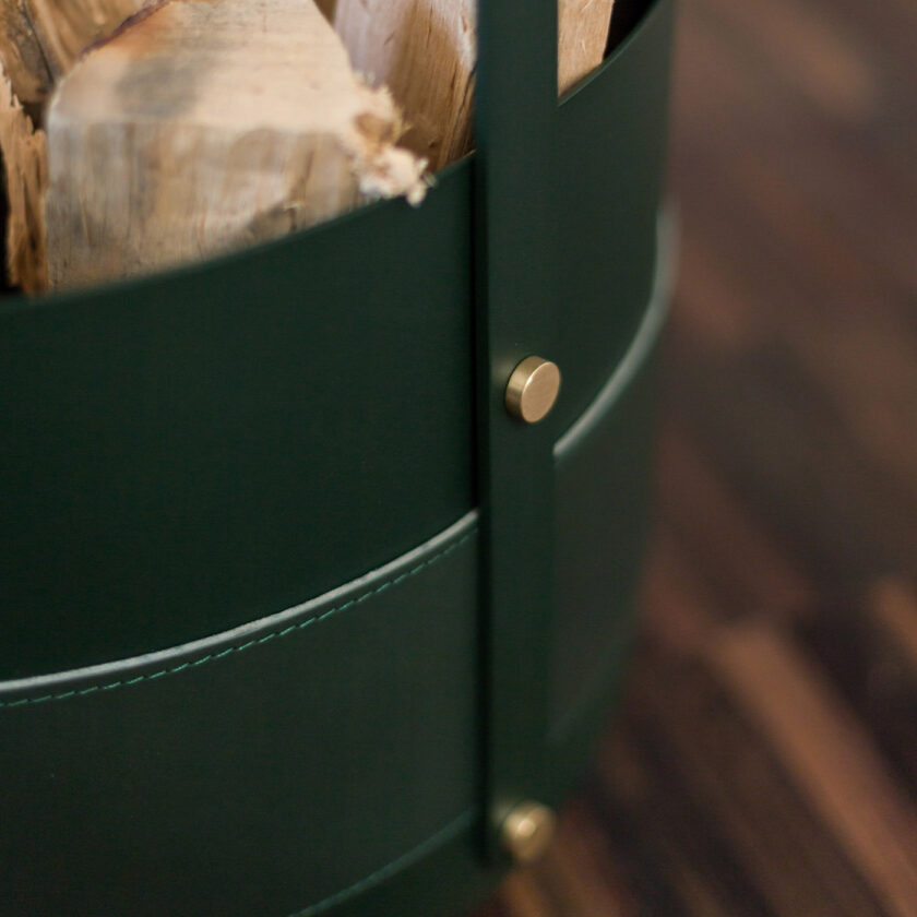 Close up of Emma Basket in Forêt (green powder-coated steel, green leather and solid brass details).