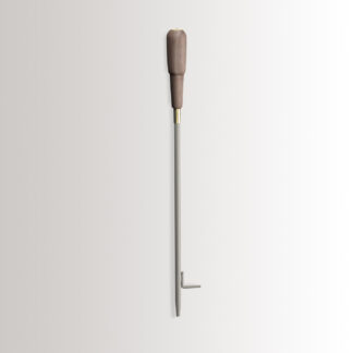 Emma Blow Poker in Paris combines medium grey powder-coated steel, with a walnut wood handle and brass details.