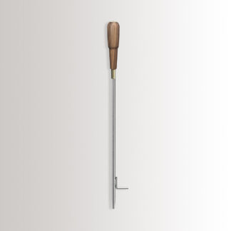 Emma Blow Poker in Lumière combines stainless steel, with an oiled walnut wood handle and brass details.
