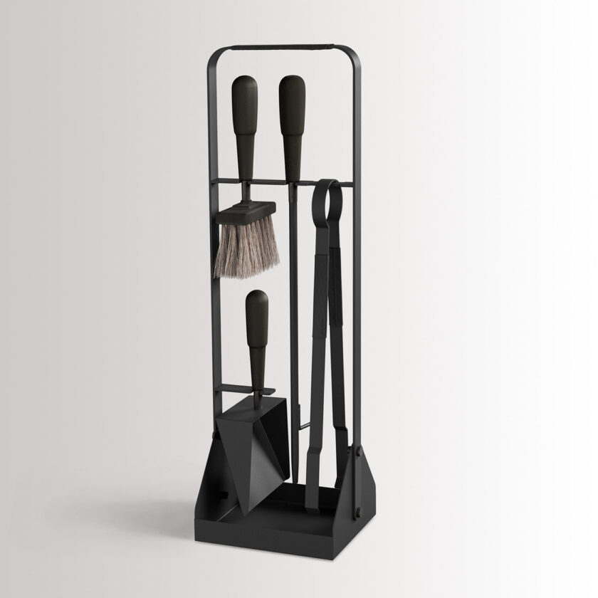 Emma Companion Set in Noir combines charcoal black powder-coated steel, with “Noir” leather, black stained beech wood handles and black details.