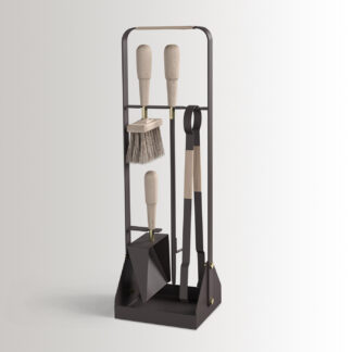 Emma Companion Set in Naturel combines dark warm grey powder-coated steel, with “Naturel” beige leather, beech wood handles and details in solid brass.