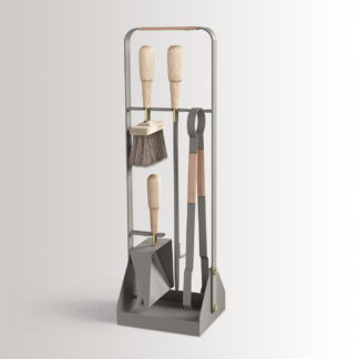 Emma Companion Set in Scandie combines medium grey powder-coated steel, with "Naturel” beige leather, beech wood handles and details in solid brass.