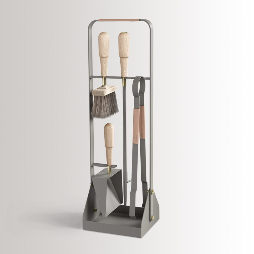 Emma Companion Set in Scandie combines medium grey powder-coated steel, with "Naturel” beige leather, beech wood handles and details in solid brass.