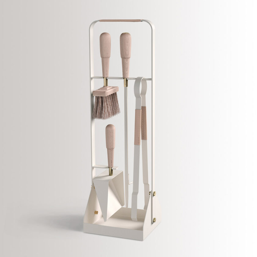Emma Companion Set in Blanc combines cream white powder-coated steel, with “Naturel” beige leather, beech wood handles and details in solid brass.