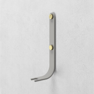 Emma Wall Hook in Paris is made of medium grey powder-coated steel, with brass details.
