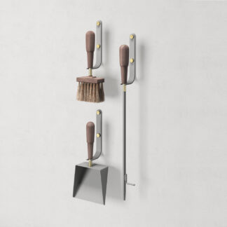 Emma Wall in Paris (medium grey powder-coated steel, walnut wood and brass details) includes 3 wall hooks, a blow poker, and a shovel and brush.