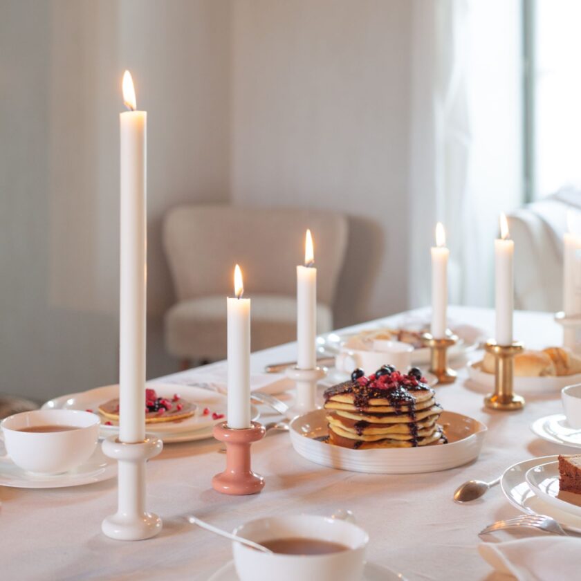 A breakfast table, accompanied by Lucie Candle Holders in various colours and sizes.