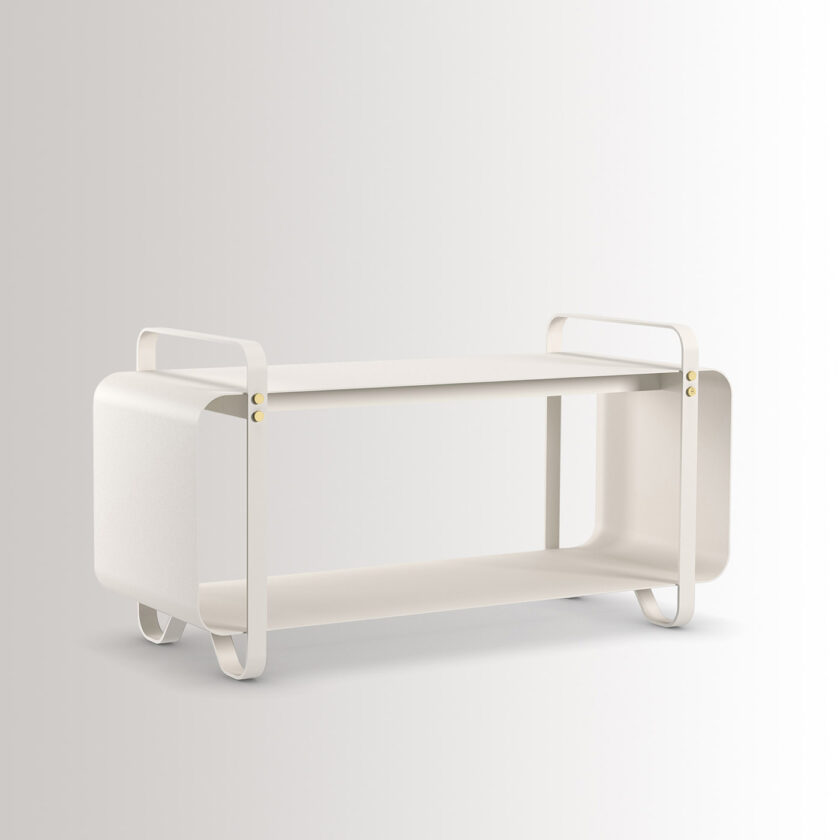 The outdoor version of the Ninne Bench in Blanc combines cream white powder-coated galvanised steel, with brass details, at an angle.