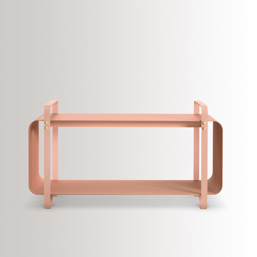 Ninne Bench in BonBon is made from pink powder-coated steel, with brass details.