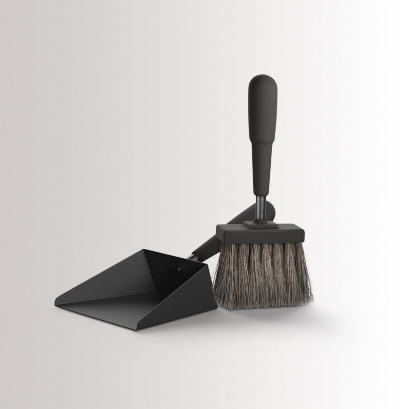 Emma Shovel & Brush in Noir combines charcoal black powder-coated steel, with black stained beech wood and black details, at an angle.