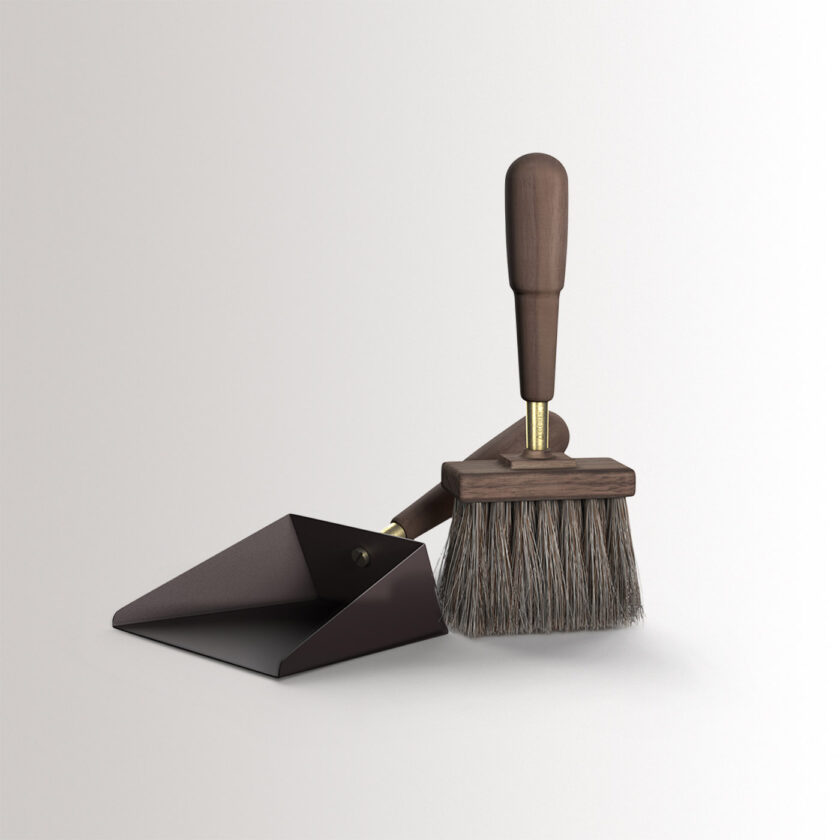 Emma Shovel & Brush in Classique combines dark warm grey powder-coated steel, with walnut wood and brass details, at an angle.