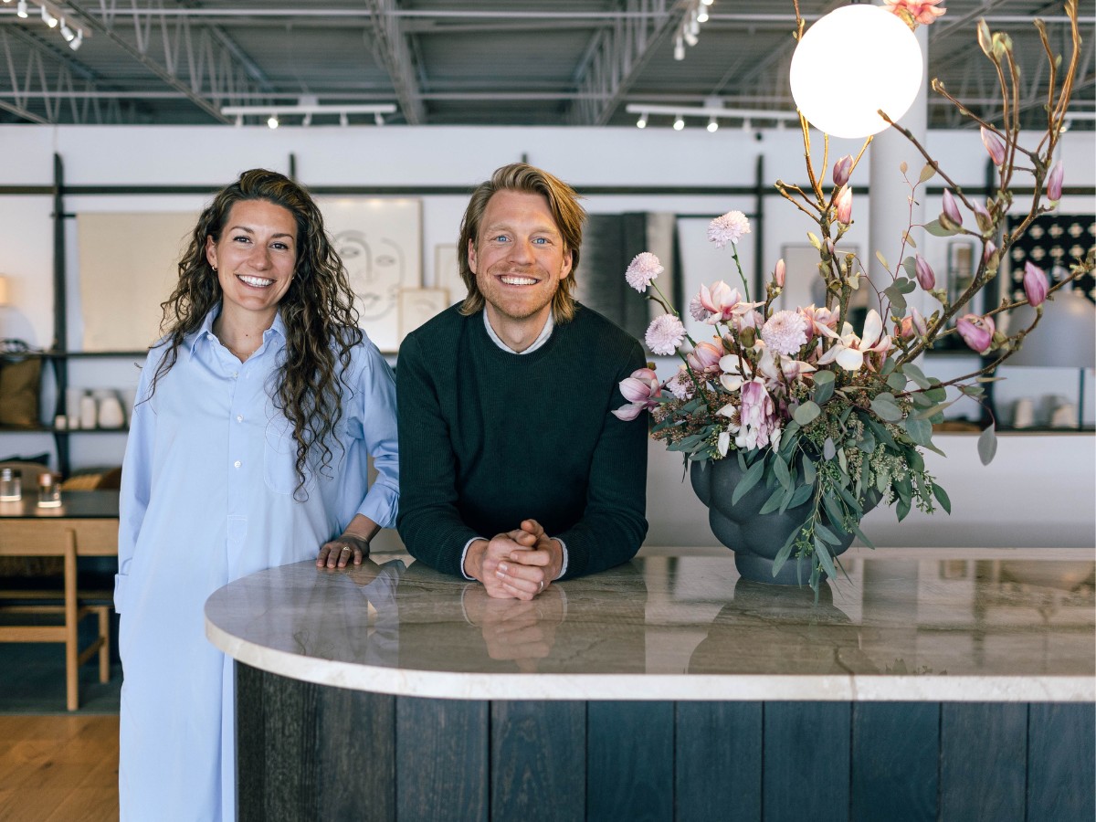 Hygge Life founders Alexandra Gove and Koen van Renswoude looking at the camera and smiling.