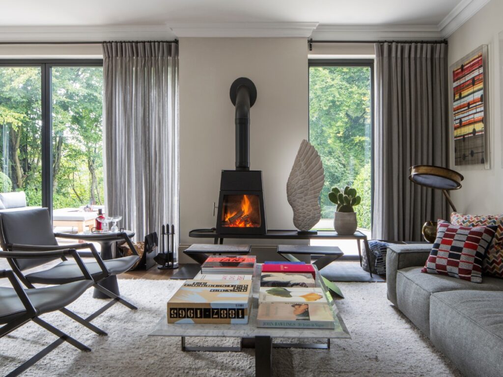 Fireplace in a living room space by Tollgard Design.