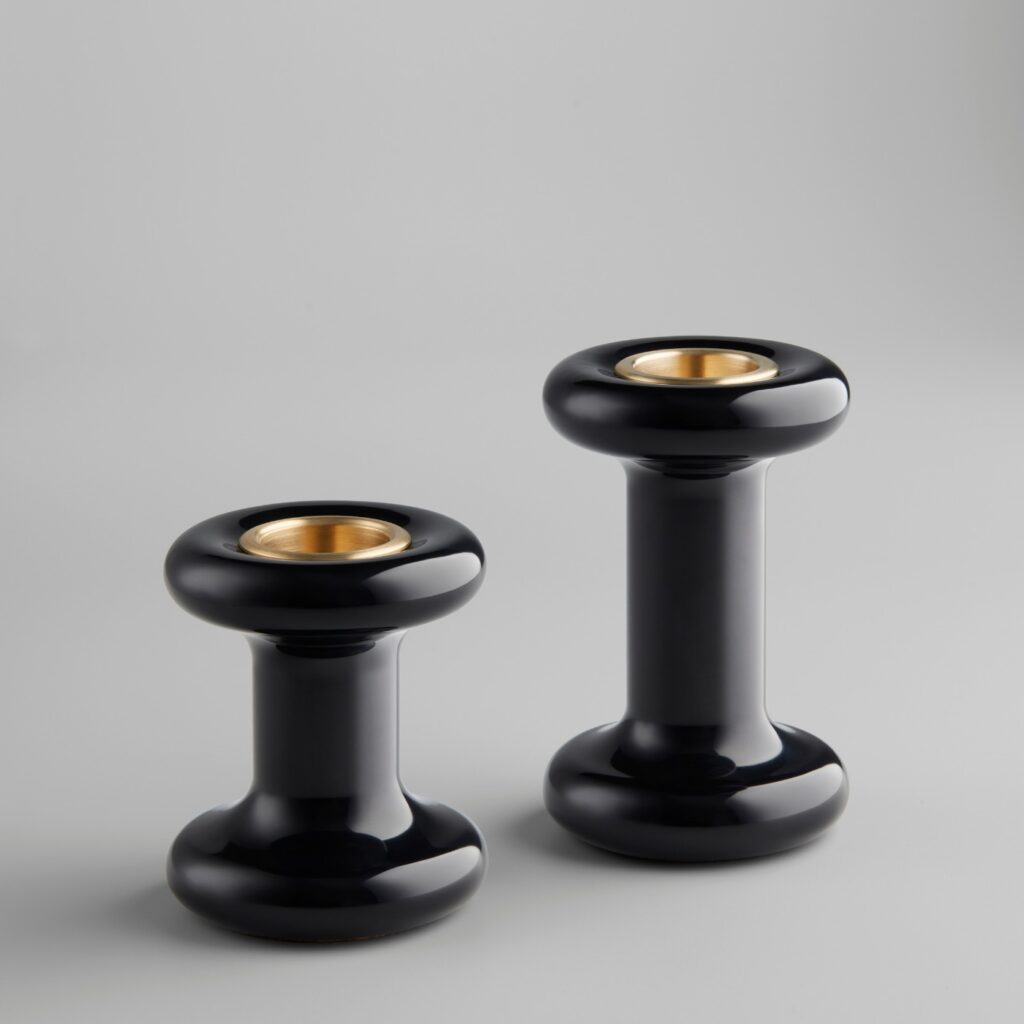 A pair of black Lucie Candle Holders, without candles, on a plain background.