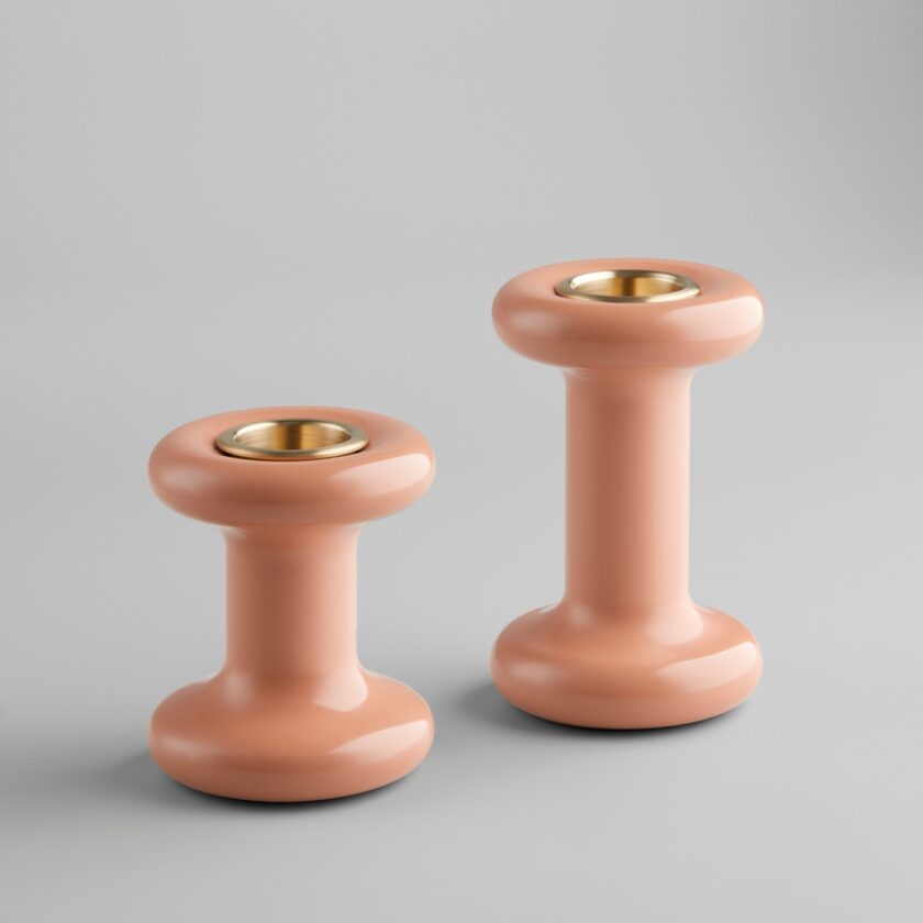 A pair of pink Lucie Candle Holders, without candles, on a plain background.