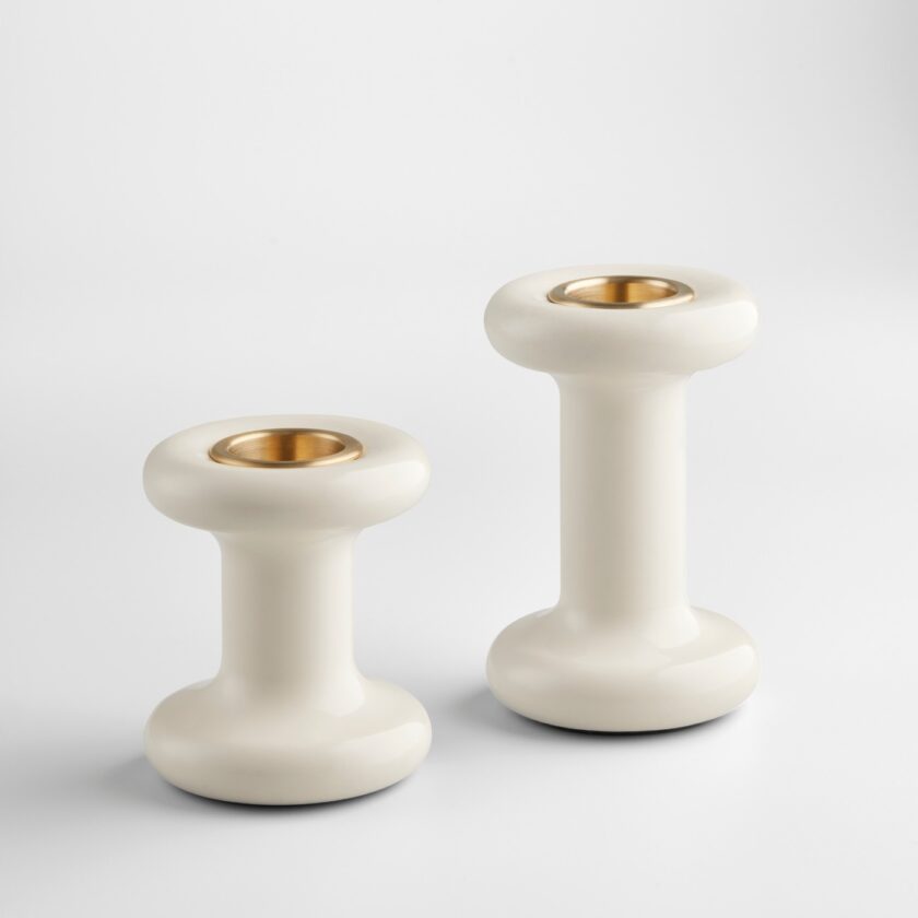 A pair of white Lucie Candle Holders, without candles, on a plain background.