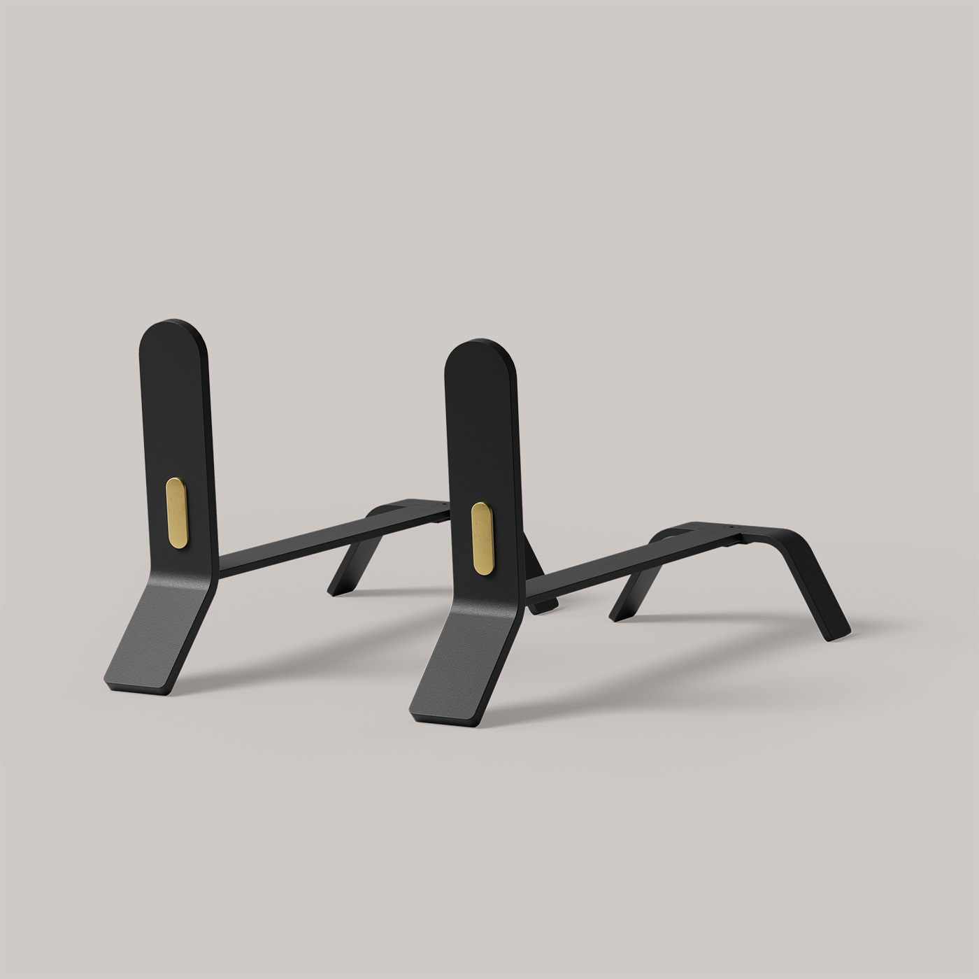 A sleek, modern pair of black push-up bars with gold highlights, designed for workouts. They feature a minimalist design with emphasis on stability and ergonomic comfort. The background is a seamless gradient from light gray to white.