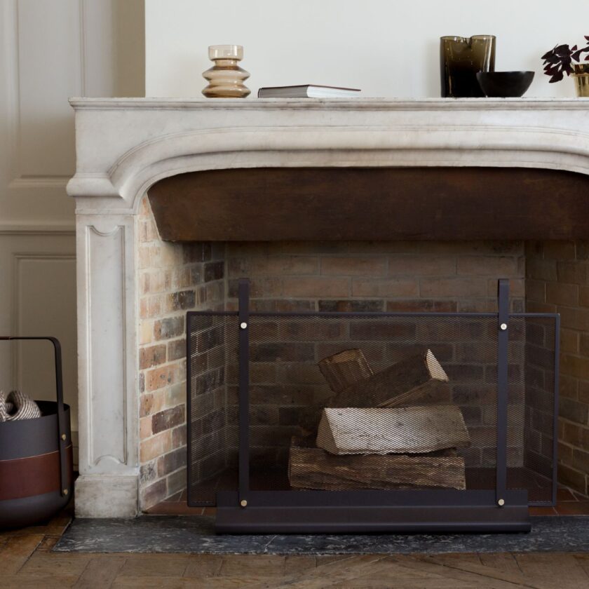 Classique Firescreen in front of an unlit fireplace.