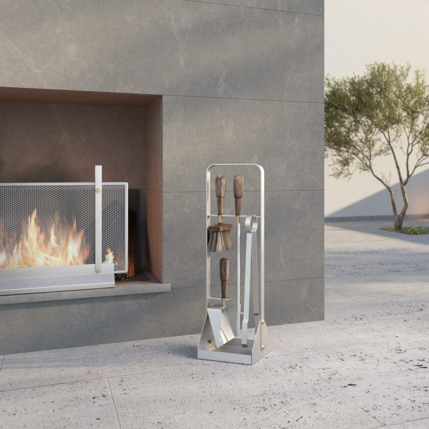 Small Fire screen in Lumière with Emma Companion Set outdoors in front of lit fire.