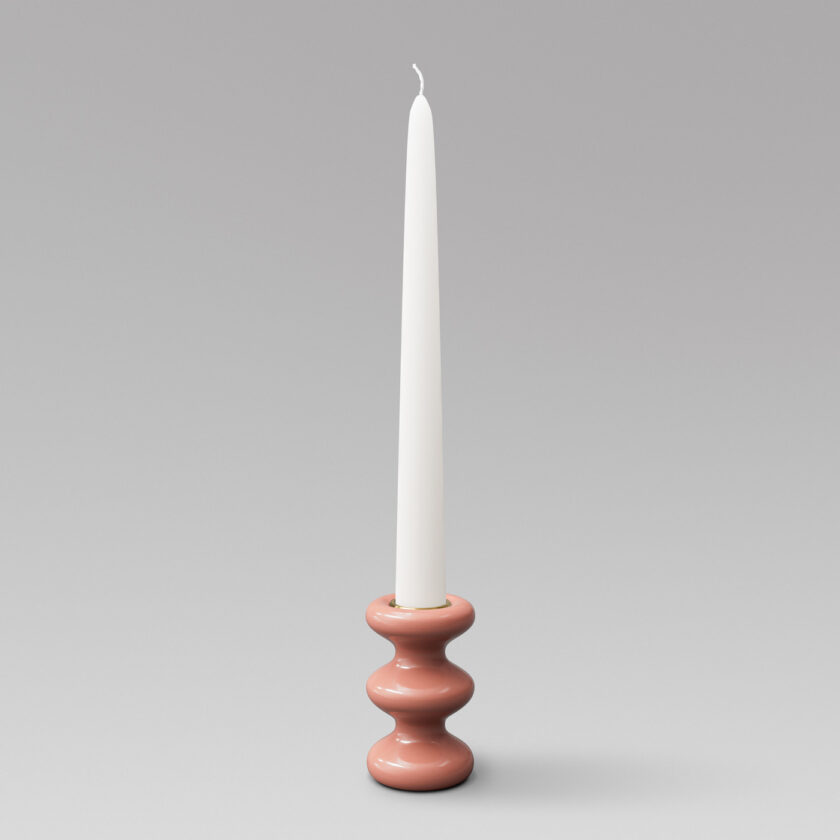 LouLou in BonBon (pink powder-coated steel) with a brass insert and unlit candle.