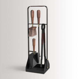 Emma Companion Set in Minuit combines charcoal black powder-coated steel, with chocolate brown leather, oiled walnut wood handles and details in solid brass.