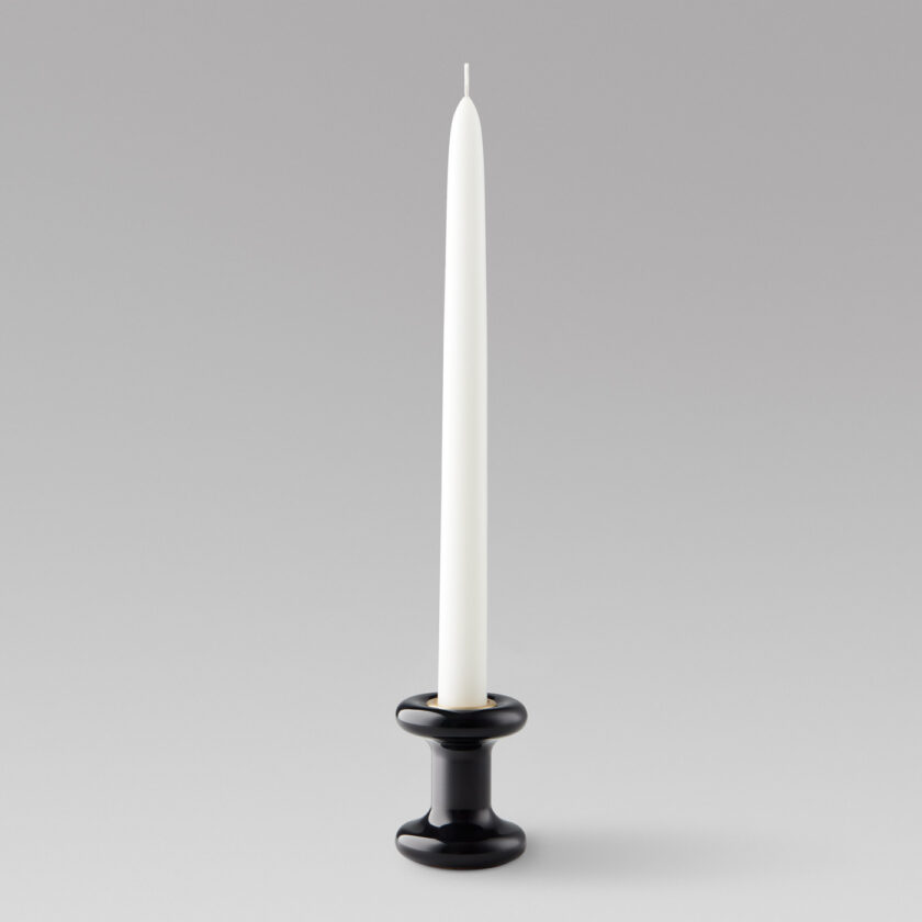 Lucie candle holder short in Noir (black powder-coated steel) with a brass insert and unlit candle.