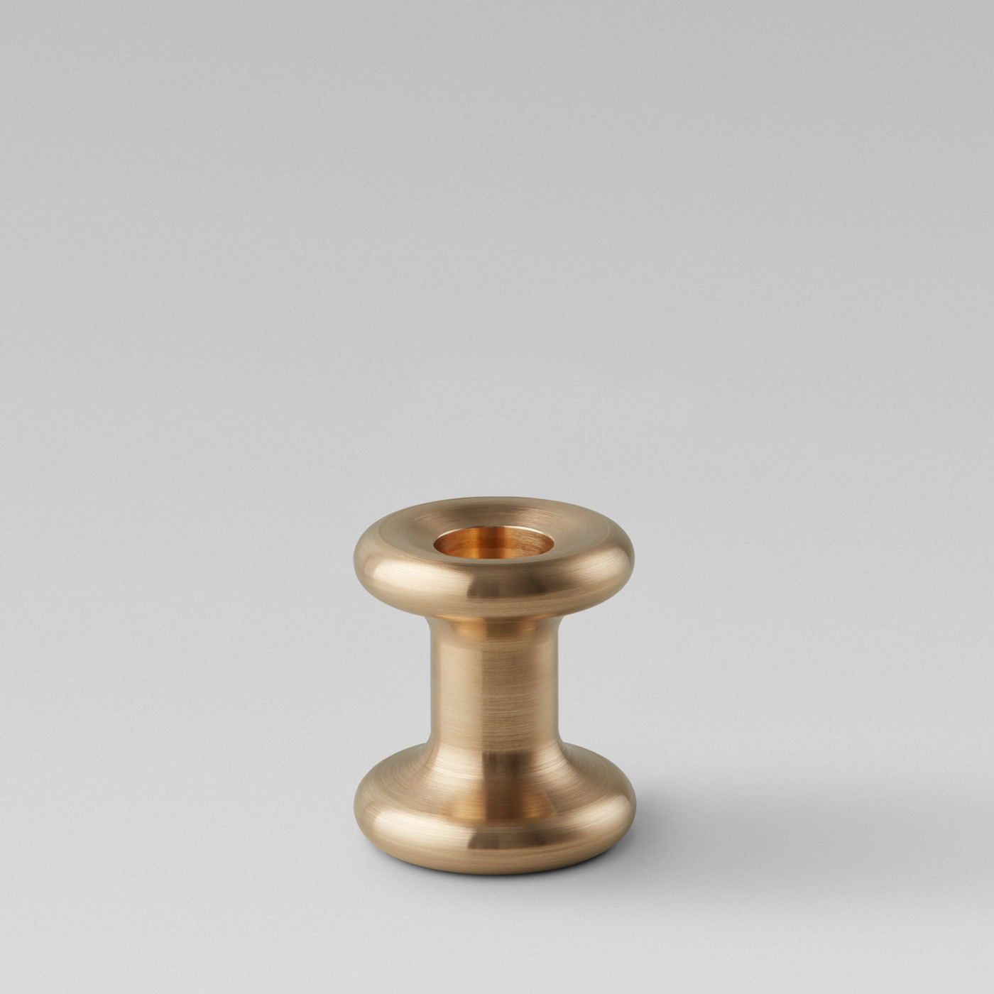Lucie Candle Holder Short in solid brass without a candle.