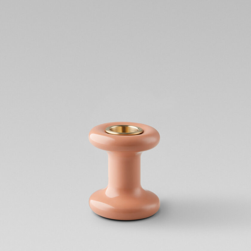 Lucie candle holder short in BonBon (pink powder-coated steel) with a brass insert without a candle.
