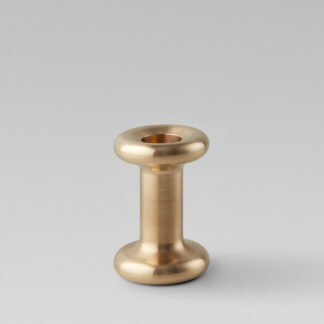 Lucie Candle Holder Tall in solid brass without a candle.