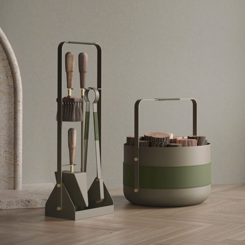 Emma Companion Set in Olive (beige grey powder-coated steel, “Olive” green leather, oiled walnut handles and details in solid brass) next to a basket in the same colour.