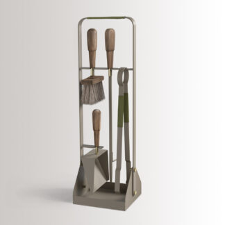Emma Companion Set in Olive combines beige grey powder-coated steel, with olive green leather, oiled walnut wood handles and details in solid brass.