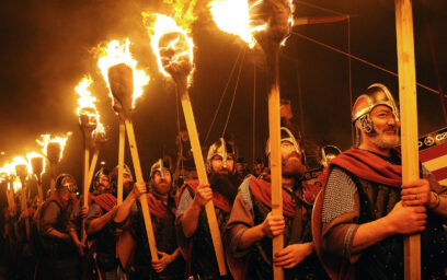 Men dressed in armour carrying torches participating in the Up Helly Aa, Shetland's biggest annual fire festival.