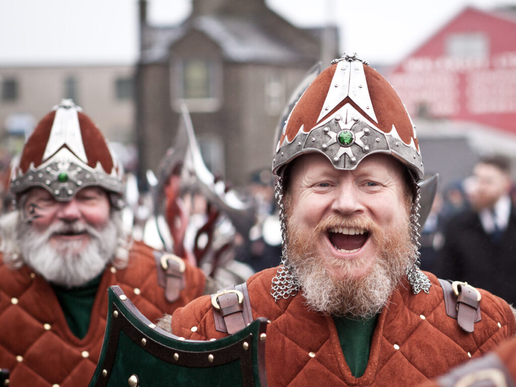 Two Men dressed in armour participating in the Up Helly Aa, a fire of festival in Shetland, Scotland.