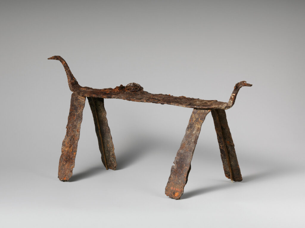 An iron andiron dating back to late 4th or early 3rd century B.C. It is part of the Greek and Roman Art collection at The Metropolitan Museum of Art in New York City.