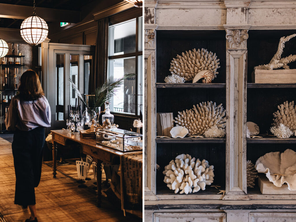 Two photos of one of the Suzie Anderson Home locations in New South Wales, Australia. One shows a collection of dried coral and the other shows a display case with jewellery and some glassware.