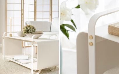 The Ninne Bench in Classique being used as firewood storage, with a taupe vase on it. To the right is the Emma Companion Set Classique.