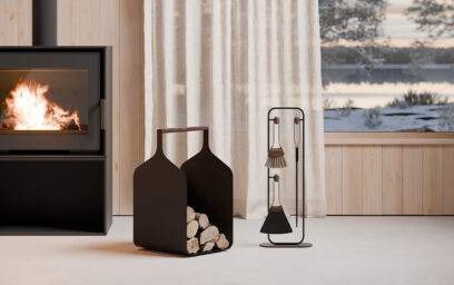 Fumi Series of fireside tools and log holder in black, next to a stove